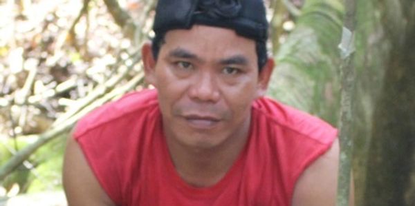 Porter helping with jungle trekking in Bukit Lawang, Sumatra.