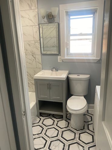 fully remodeled bathrooms porcelain tile finish. 