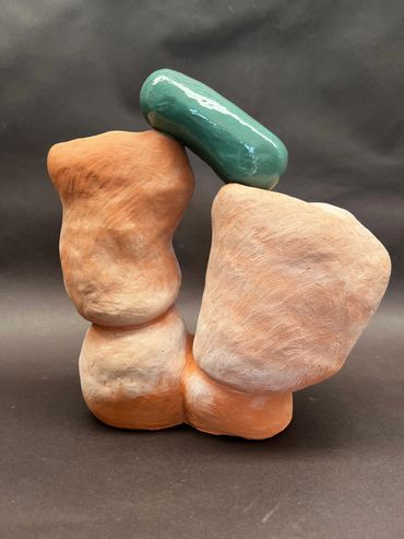 Power Yoga Abstract ceramic sculpture with earthy tones and a glossy green element.