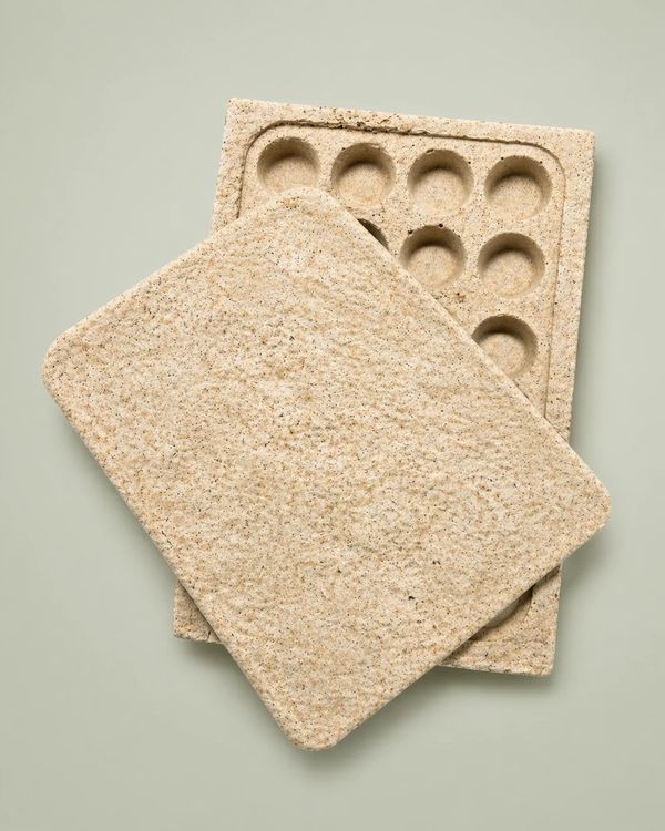 Eco-friendly molded pulp tray with lid.
