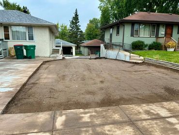 A freshly graded driveway prepped for asphalt.