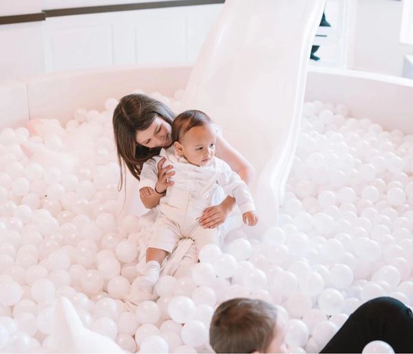 child in ballpit at baptism