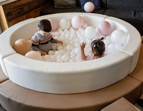 children playing in ball pit