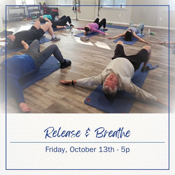Group stretching and breathing exercise session on mats, promoting relaxation.