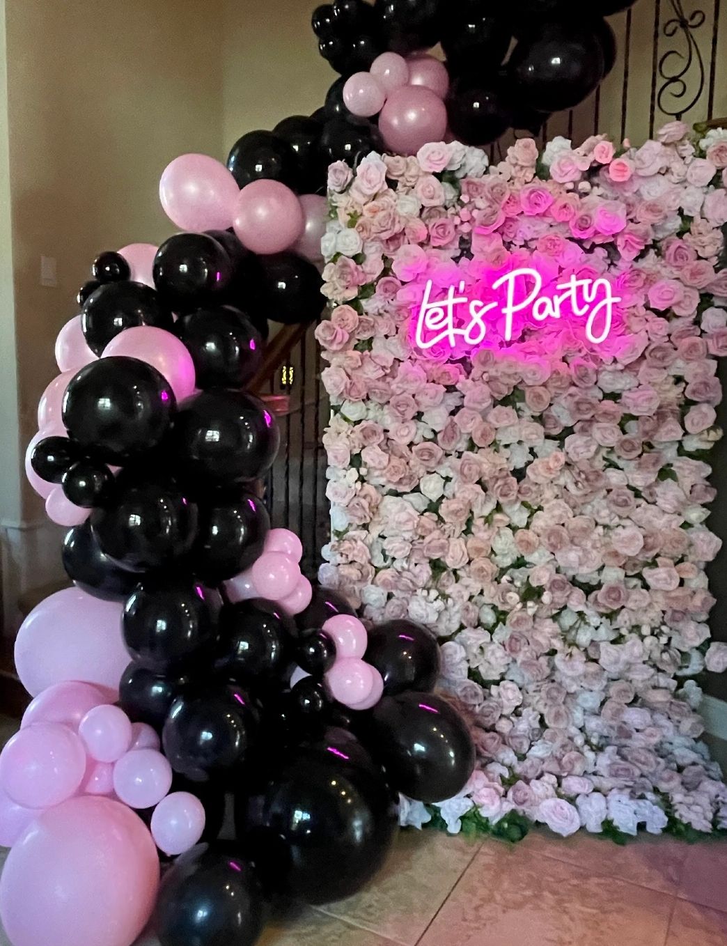 balloon arch pink and black party