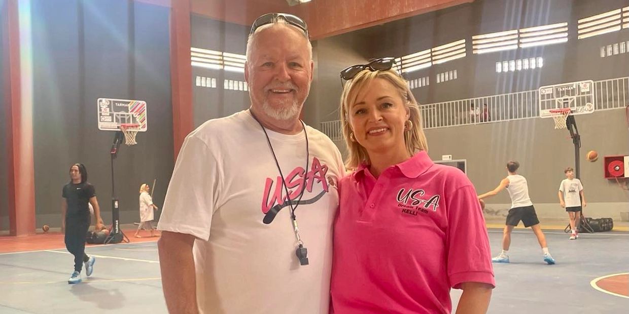 Founder and Managing Director of Thru Sport, Kelli L. Krzynowek, stands proudly alongside her profes