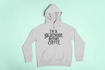 Light gray hoodie with the phrase "I'm a nightmare before coffee" in black font.