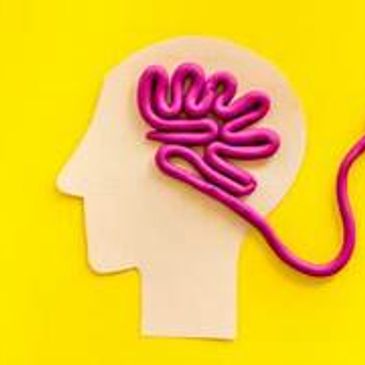 A head silhouette with a brain made from a purple electrical cord ending in a plug.