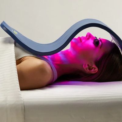 Client getting red light therapy. Red and Blue Light acne wrinkles anti facial treatment. body