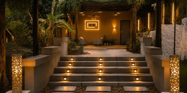 Elegant outdoor steps illuminated with warm, ambient lighting at night.