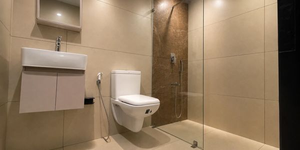 Modern minimalistic bathroom with wall-mounted toilet and floating sink.