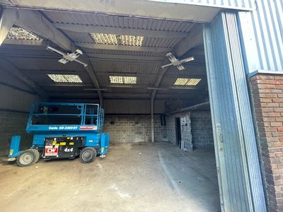 Mobile Elevating Work Platforms MEWPs to access asbestos barn roof.