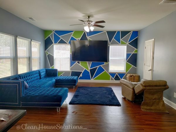 Living Room Cleaning. HouseCleaning. Blue velvet couch. Velvet furniture. Line wall painting art