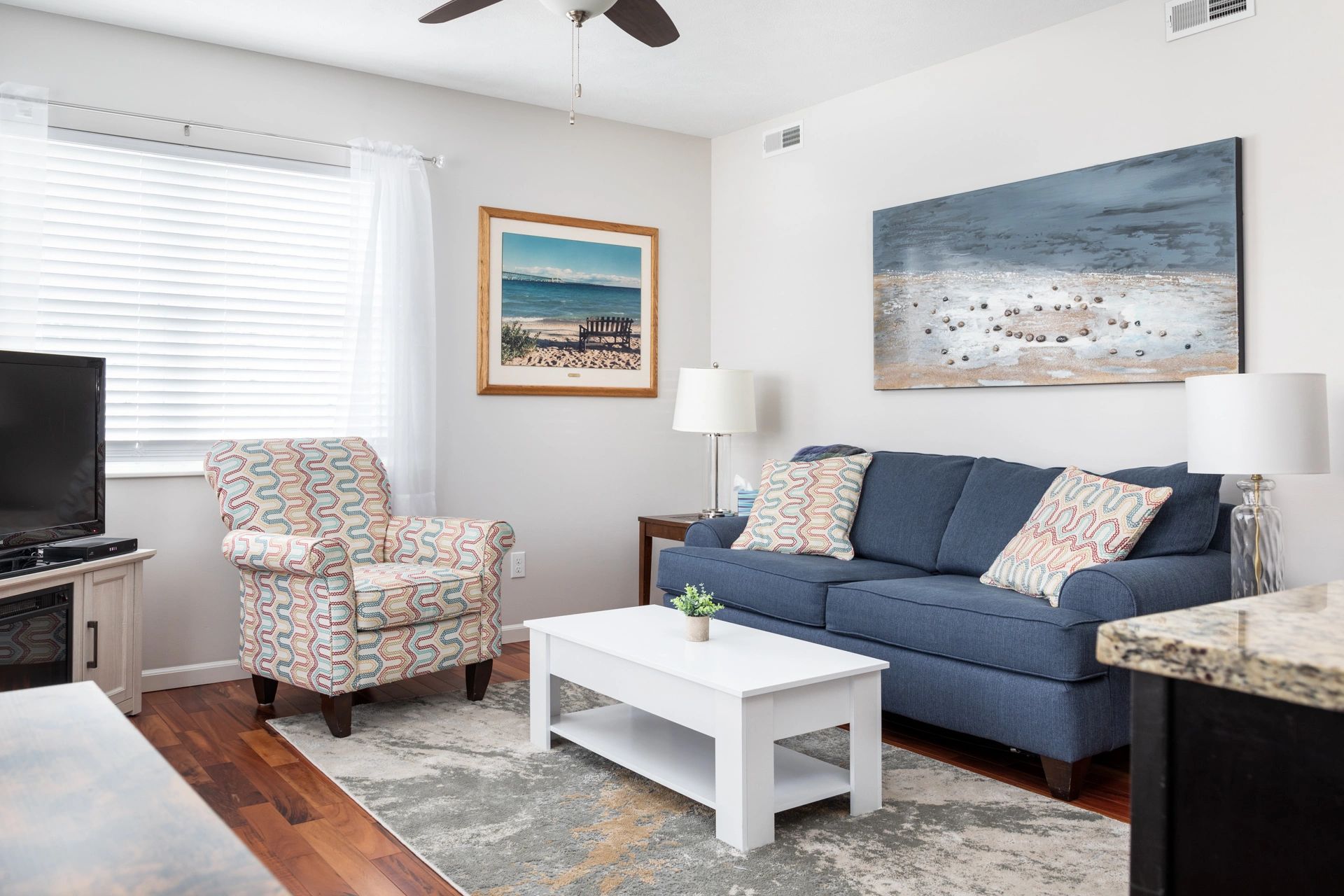 Cozy living space with electric fireplace and smart tv.