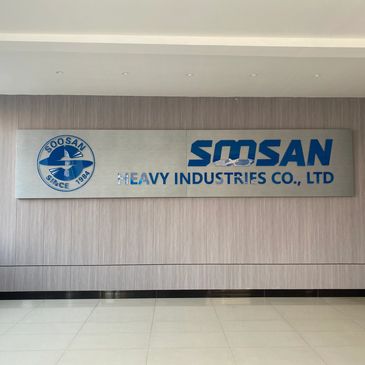 Soosan Heavy Industries sign: corporate office wall display for industrial equipment manufacturer.