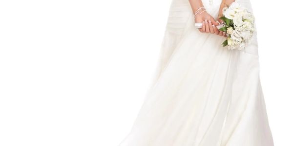 Bride in white gown holding a bouquet of white flowers.