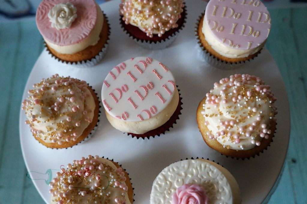 wedding shower themed cupcakes with fondant toppers and sprinkles