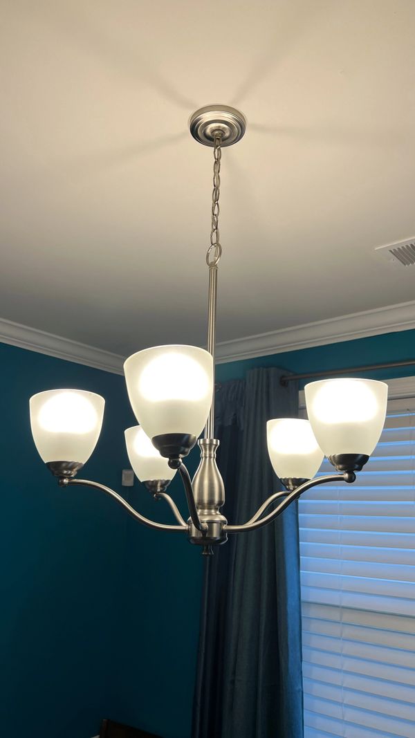 Hanging light installation in a room.