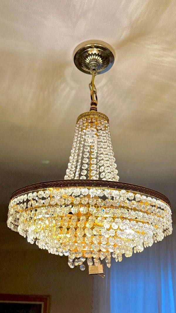 A chandelier installed in a living room.