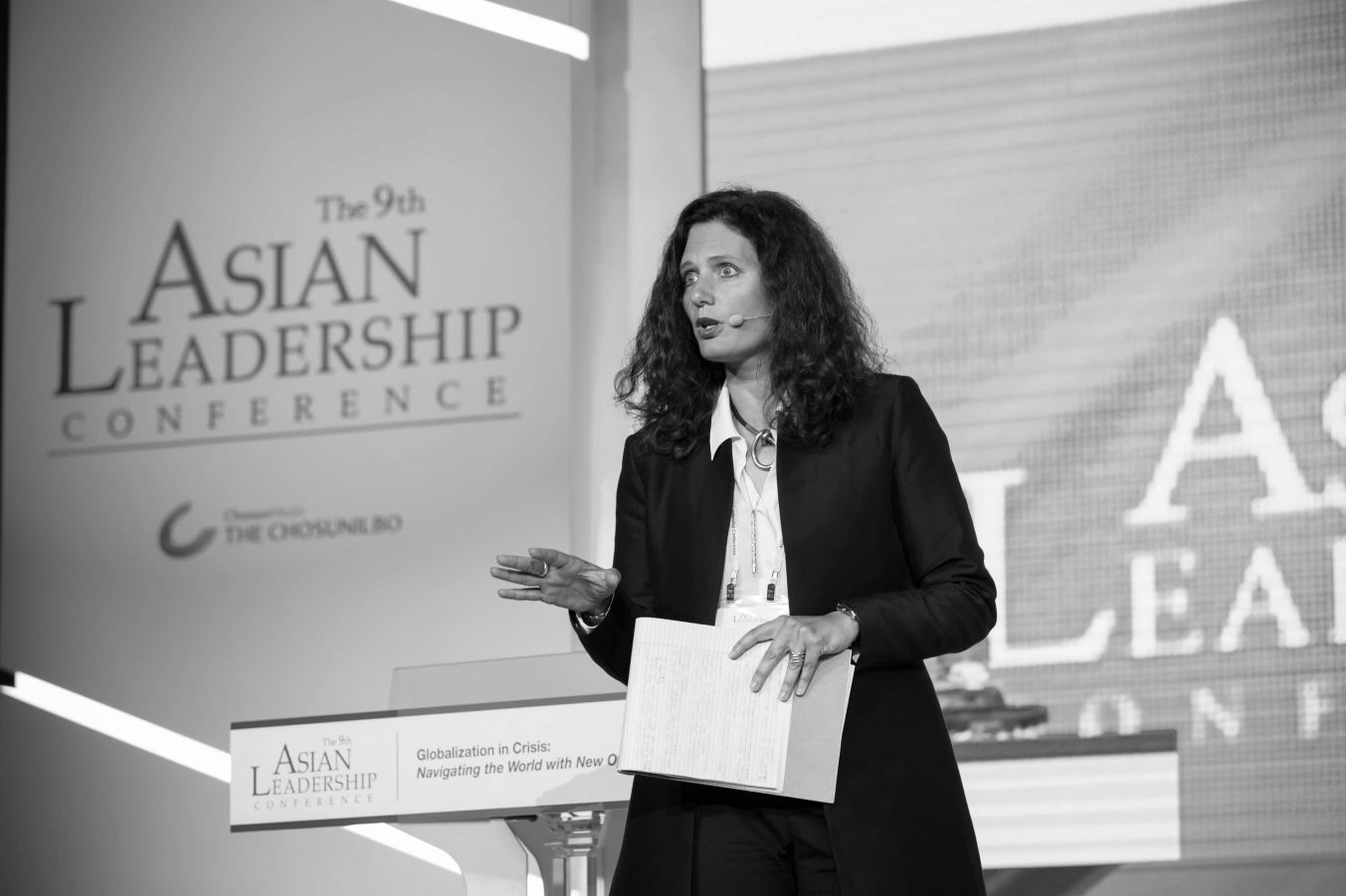 A woman speaking at the 9th Asian Leadership Conference.