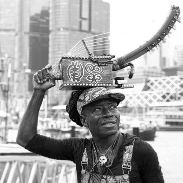 Artist from Ghana with traditional music instrument