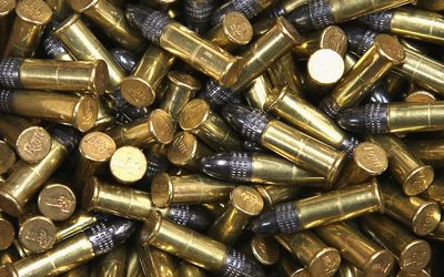 Close-up of brass and lead bullets piled together.