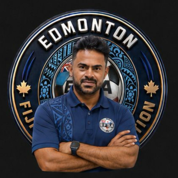Man standing confidently in front of Edmonton Fiji Association logo.