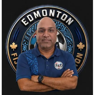 Man standing confidently in front of Edmonton Fiji Soccer Association logo.
