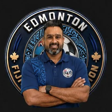 Man posing confidently in front of Edmonton Fiji Soccer Association logo.