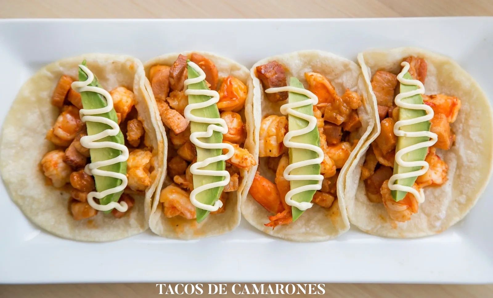 Tacos De Camarones on a white plate 