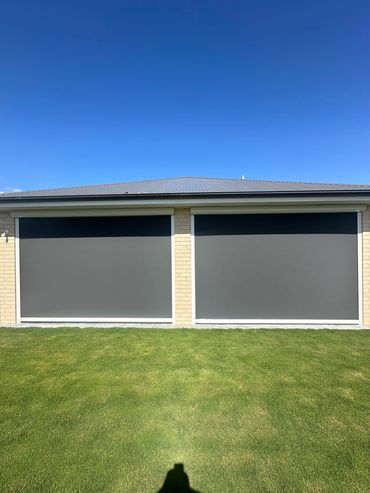 Matching Outdoor Blinds have replaced garage doors for a fresh new look.