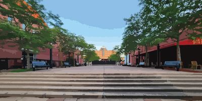 Image of the Historic Block Courtyard with steps, the plaza, trees, and benches.