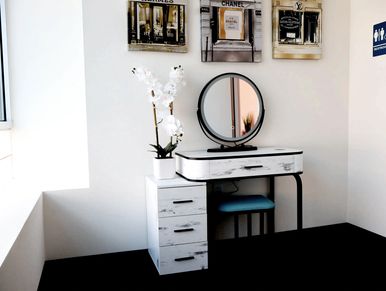 green room with big window, private bathroom, vanity, and mirror