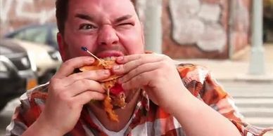 Broadway star, Benny Elledge eats a greasy burger in the Unjunk Yourself music video.