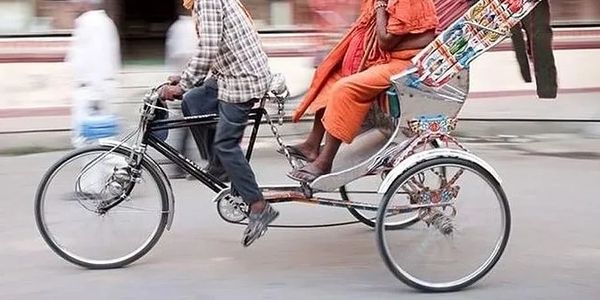 Rickshaw with puller and single rider