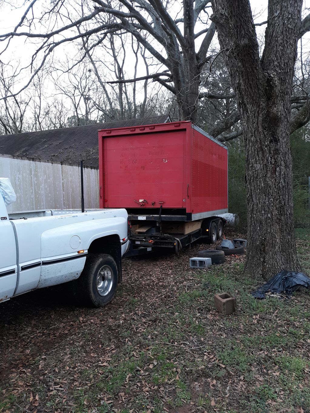 Box and trailer in back yard