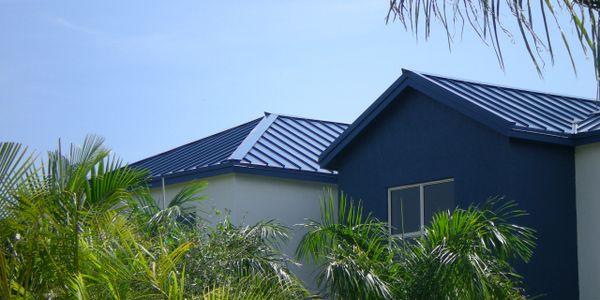 Metal Roof On Residential Building, Color Blue