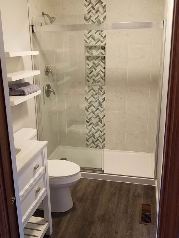 Bathroom renovation remodel licensed vanity toilet flooring install tile plumbing doors windows trim