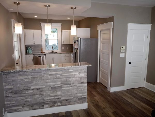 kitchen renovation remodel installer electrical plumbing sink countertop doors windows drywall tile