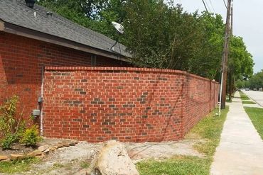 Brand new brick wall at rear of house, where a wall had fallen.