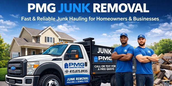 Two workers standing in front of a PMG Junk Removal truck with a house in the background.
