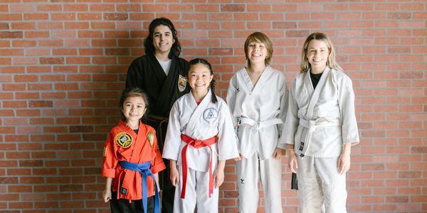 A group of students wearing karate attire 