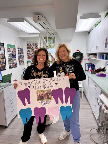 Dr. Merlino and hygienist Kristen smiling