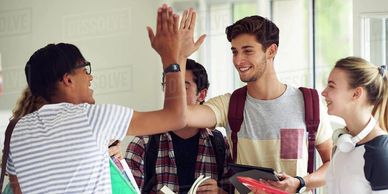 Free stock photo of teens high-fiving from dissolve dot com