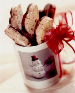 chocolate-coated biscotti in a mug