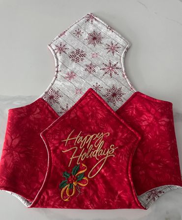 Festive cloth with Happy Holidays message and snowflake design.