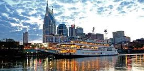 The skyline view of Nashville from the river as a boat goes by