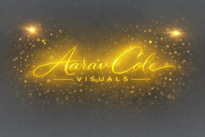 Glowing golden text 'Aarav Cole Visuals' with sparkling light effects on a dark background.