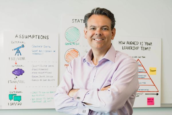Image of Dan in front of a whiteboard.