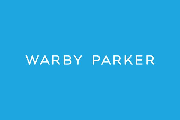Warby Parker logo on a blue background.
